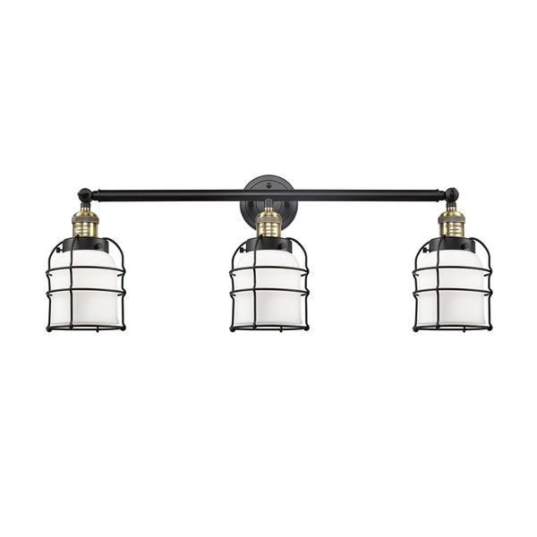 Bell Cage Bath Vanity Light shown in the Black Antique Brass finish with a Matte White shade