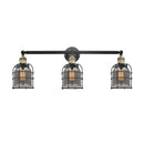 Bell Cage Bath Vanity Light shown in the Black Antique Brass finish with a Plated Smoke shade