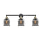 Bell Cage Bath Vanity Light shown in the Black Antique Brass finish with a Plated Smoke shade