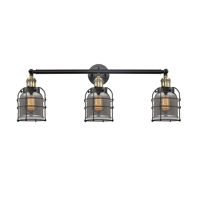 Bell Cage Bath Vanity Light shown in the Black Antique Brass finish with a Plated Smoke shade