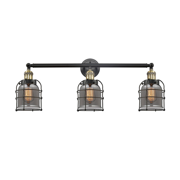 Bell Cage Bath Vanity Light shown in the Black Antique Brass finish with a Plated Smoke shade