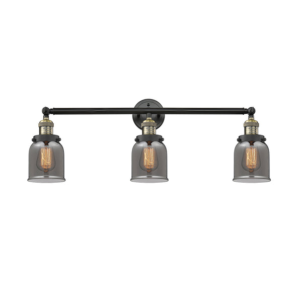 Bell Bath Vanity Light shown in the Black Antique Brass finish with a Plated Smoke shade