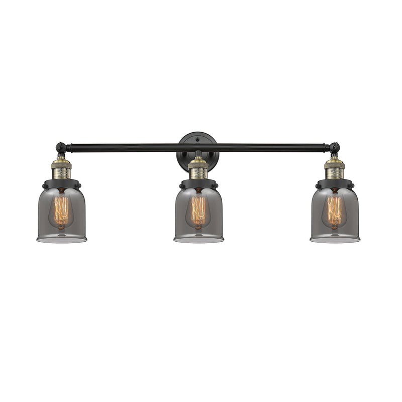Bell Bath Vanity Light shown in the Black Antique Brass finish with a Plated Smoke shade