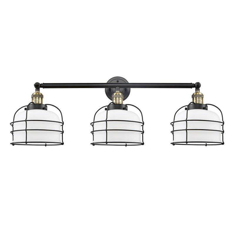 Bell Cage Bath Vanity Light shown in the Black Antique Brass finish with a Matte White shade