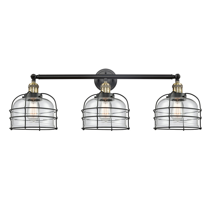 Bell Cage Bath Vanity Light shown in the Black Antique Brass finish with a Clear shade