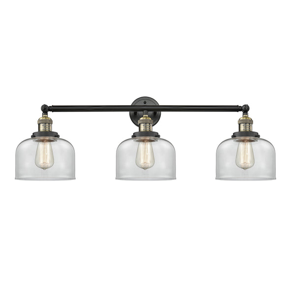 Bell Bath Vanity Light shown in the Black Antique Brass finish with a Clear shade