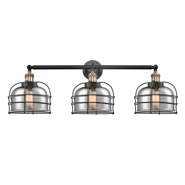Bell Cage Bath Vanity Light shown in the Black Antique Brass finish with a Plated Smoke shade
