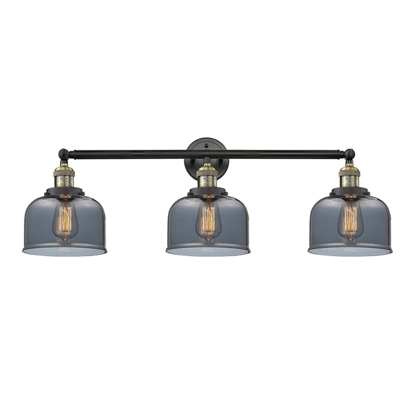 Bell Bath Vanity Light shown in the Black Antique Brass finish with a Plated Smoke shade