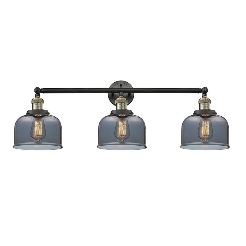 Bell Bath Vanity Light shown in the Black Antique Brass finish with a Plated Smoke shade
