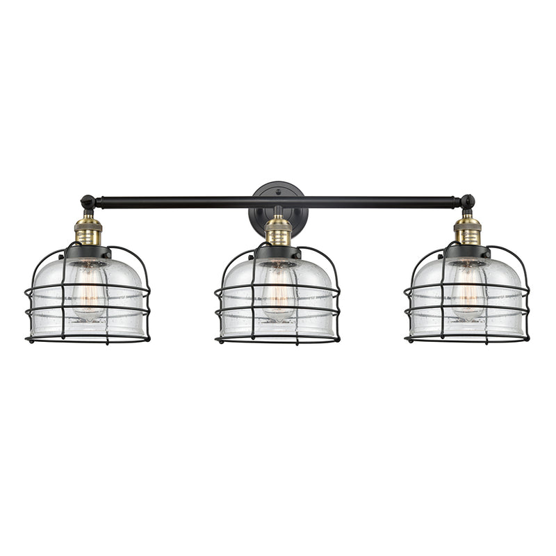 Bell Cage Bath Vanity Light shown in the Black Antique Brass finish with a Seedy shade
