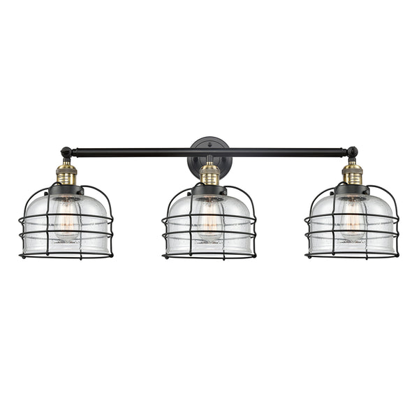 Bell Cage Bath Vanity Light shown in the Black Antique Brass finish with a Seedy shade
