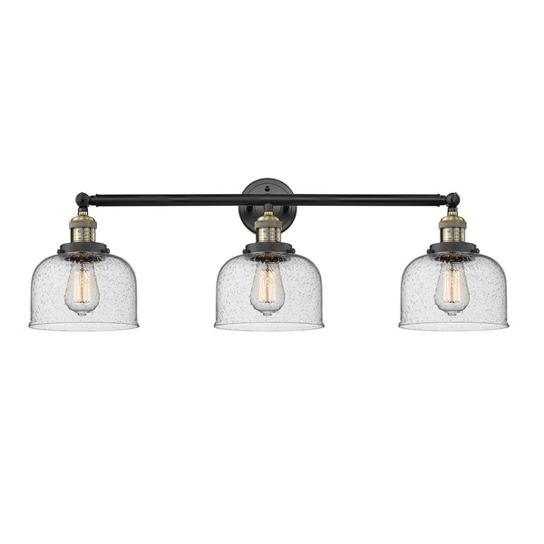 Bell Bath Vanity Light shown in the Black Antique Brass finish with a Seedy shade