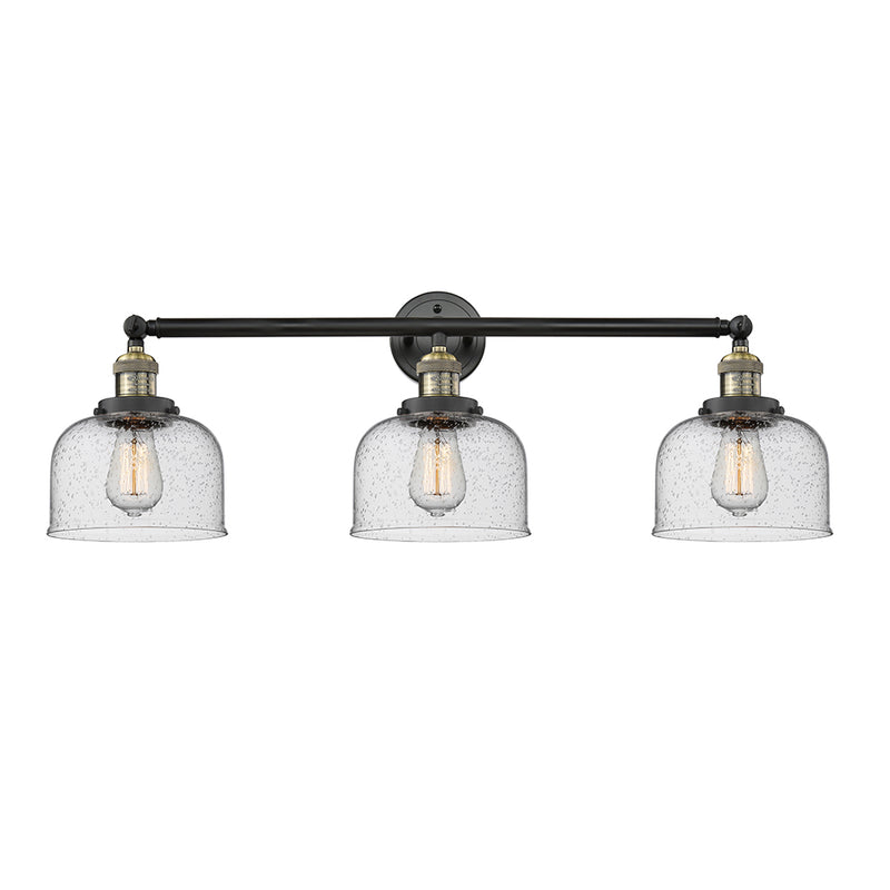 Bell Bath Vanity Light shown in the Black Antique Brass finish with a Seedy shade