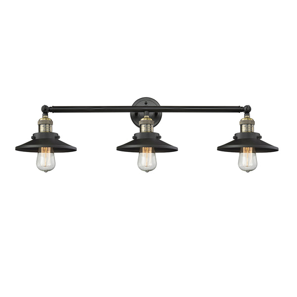 Railroad Bath Vanity Light shown in the Black Antique Brass finish with a Matte Black shade