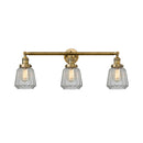 Chatham Bath Vanity Light shown in the Brushed Brass finish with a Clear shade