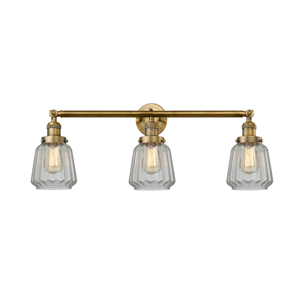 Chatham Bath Vanity Light shown in the Brushed Brass finish with a Clear shade