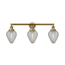 Geneseo Bath Vanity Light shown in the Brushed Brass finish with a Clear Crackled shade