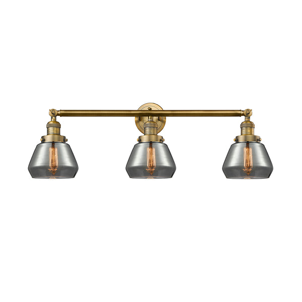 Fulton Bath Vanity Light shown in the Brushed Brass finish with a Plated Smoke shade
