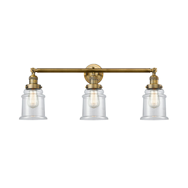 Canton Bath Vanity Light shown in the Brushed Brass finish with a Clear shade