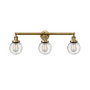 Beacon Bath Vanity Light shown in the Brushed Brass finish with a Seedy shade