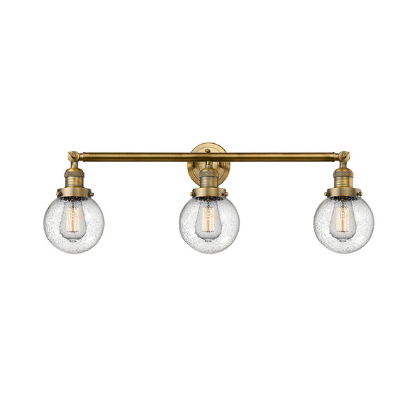 Beacon Bath Vanity Light shown in the Brushed Brass finish with a Seedy shade