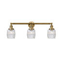 Colton Bath Vanity Light shown in the Brushed Brass finish with a Clear Halophane shade