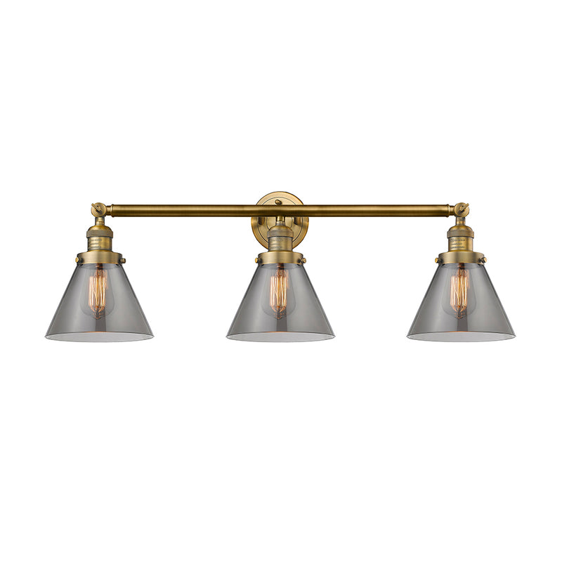 Cone Bath Vanity Light shown in the Brushed Brass finish with a Plated Smoke shade