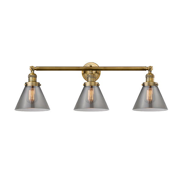 Cone Bath Vanity Light shown in the Brushed Brass finish with a Plated Smoke shade