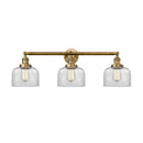 Bell Bath Vanity Light shown in the Brushed Brass finish with a Clear shade