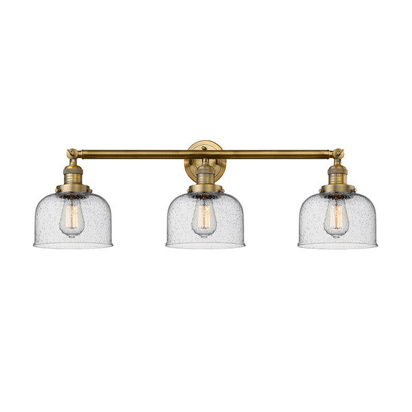 Bell Bath Vanity Light shown in the Brushed Brass finish with a Seedy shade