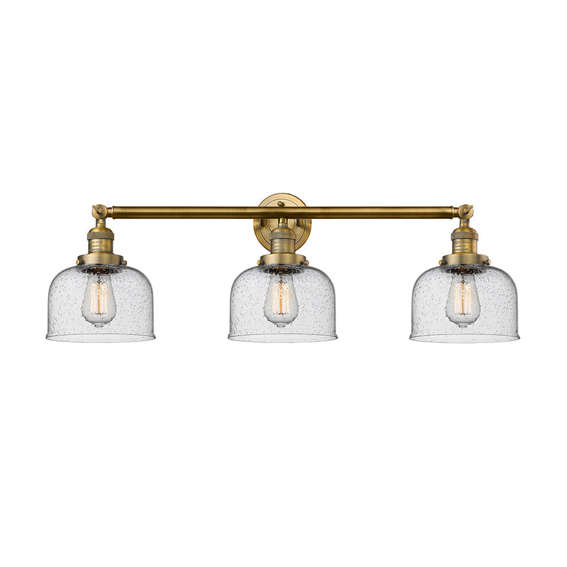 Bell Bath Vanity Light shown in the Brushed Brass finish with a Seedy shade