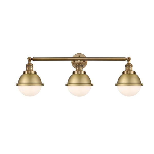 Hampden Bath Vanity Light shown in the Brushed Brass finish with a Matte White shade