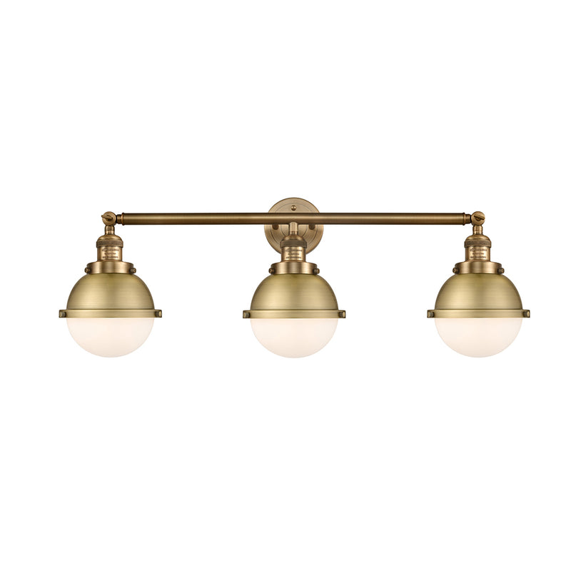 Hampden Bath Vanity Light shown in the Brushed Brass finish with a Matte White shade
