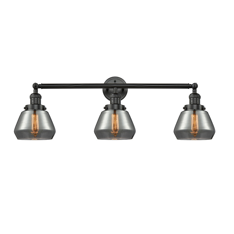Fulton Bath Vanity Light shown in the Matte Black finish with a Plated Smoke shade