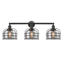 Bell Cage Bath Vanity Light shown in the Matte Black finish with a Plated Smoke shade