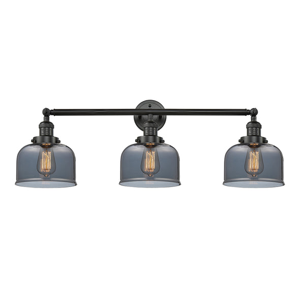 Bell Bath Vanity Light shown in the Matte Black finish with a Plated Smoke shade