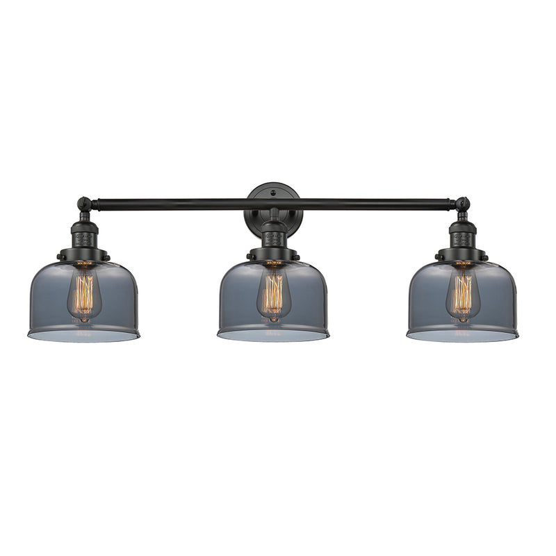 Bell Bath Vanity Light shown in the Matte Black finish with a Plated Smoke shade