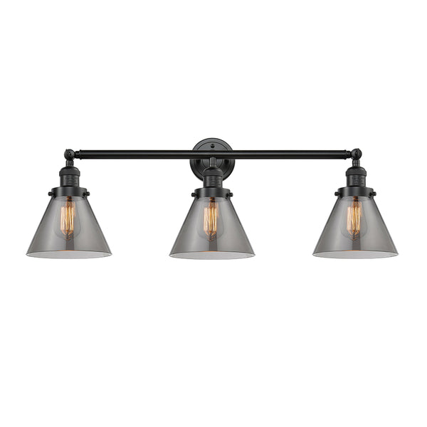 Cone Bath Vanity Light shown in the Oil Rubbed Bronze finish with a Plated Smoke shade