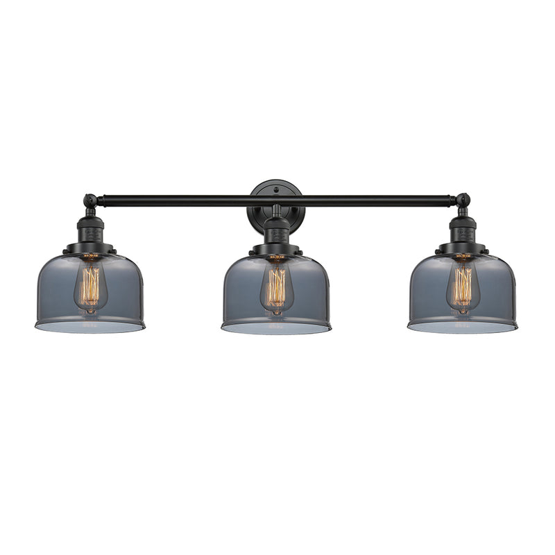 Bell Bath Vanity Light shown in the Oil Rubbed Bronze finish with a Plated Smoke shade