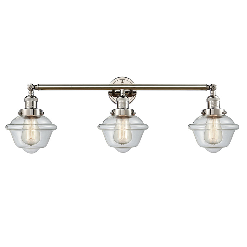 Oxford Bath Vanity Light shown in the Polished Nickel finish with a Clear shade