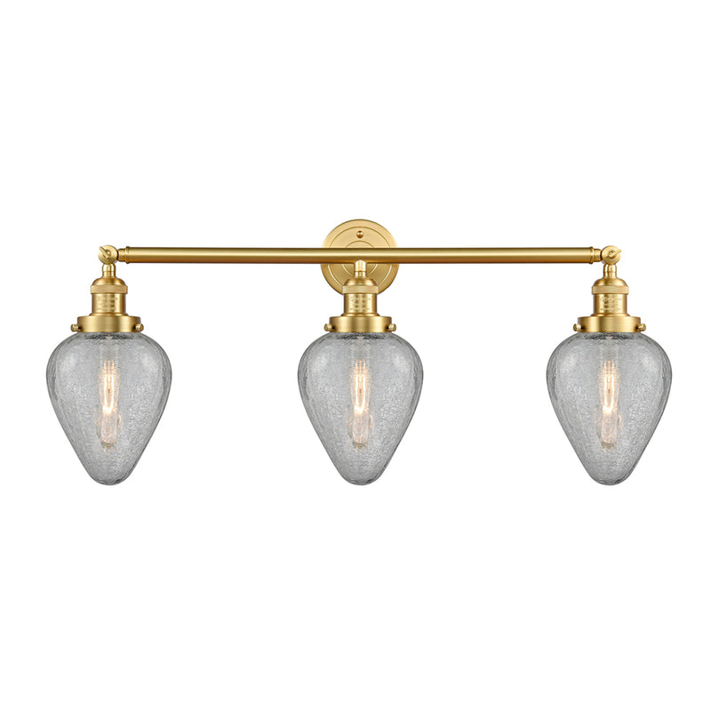 Geneseo Bath Vanity Light shown in the Satin Gold finish with a Clear Crackled shade