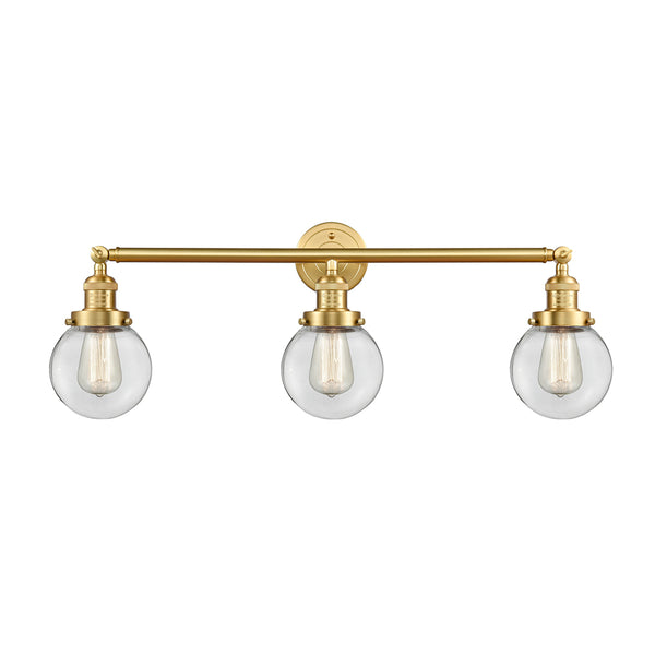 Beacon Bath Vanity Light shown in the Satin Gold finish with a Clear shade