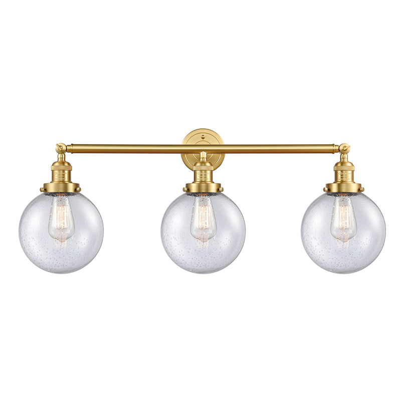 Beacon Bath Vanity Light shown in the Satin Gold finish with a Seedy shade