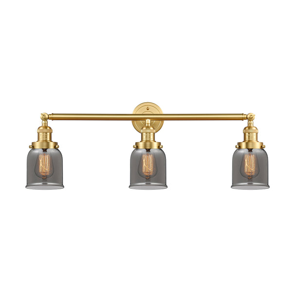 Bell Bath Vanity Light shown in the Satin Gold finish with a Plated Smoke shade