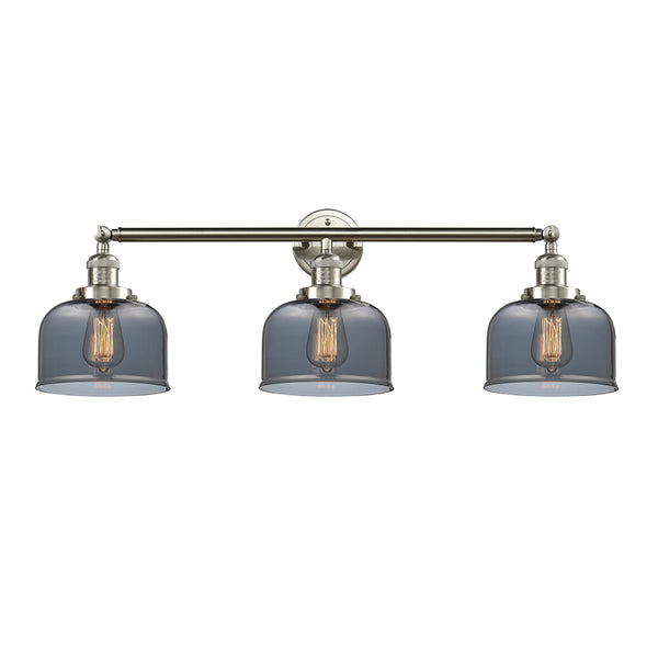 Bell Bath Vanity Light shown in the Brushed Satin Nickel finish with a Plated Smoke shade