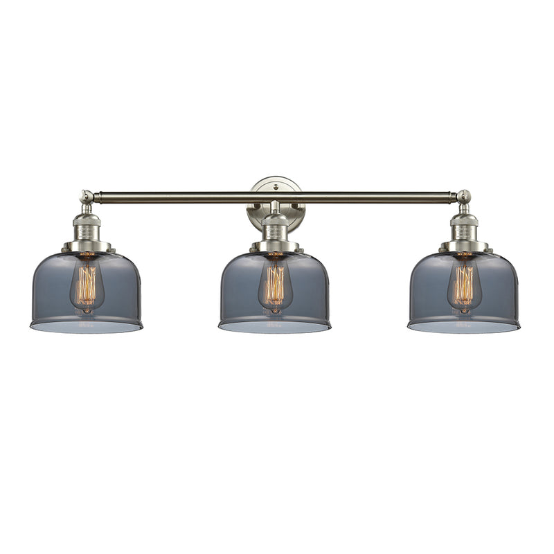 Bell Bath Vanity Light shown in the Brushed Satin Nickel finish with a Plated Smoke shade