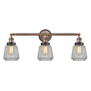 Chatham Bath Vanity Light shown in the Antique Copper finish with a Clear shade