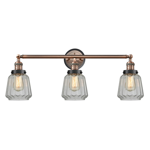 Chatham Bath Vanity Light shown in the Antique Copper finish with a Clear shade