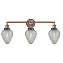 Geneseo Bath Vanity Light shown in the Antique Copper finish with a Clear Crackled shade