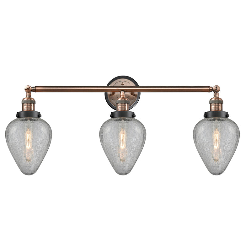 Geneseo Bath Vanity Light shown in the Antique Copper finish with a Clear Crackled shade